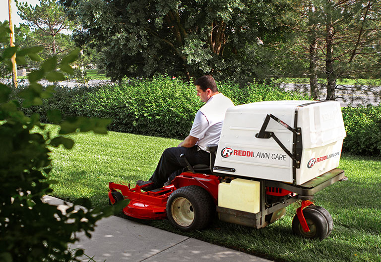 Man on Riding Lawn Mower