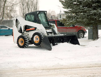 Plow Clearing Snow Pile